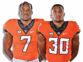 Linebacker Amen Ogbongbemiga (left) from Calgary, and Edmonton running back Chuba Hubbard -- teammates on the Oklahoma State Cowboys -- are both projected to be potential Day 3 picks in the NFL draft later this month.