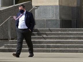 Alberta Premier Jason Kenney leaves the Federal Building at the Alberta Legislature, in Edmonton Thursday April 8, 2021. Photo by David Bloom