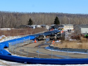 Triple dams are set up around Ptarmigan Court as temporary flood mitigation on Saturday, March 27, 2021. Laura Beamish/Fort McMurray Today/Postmedia Network