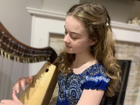 Goderich's Alexa Rose Yeo, 11, is pictured here with her harp that she used to start her small business. Handout
