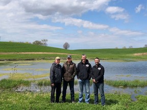 Conservationists of the Year 2021 (L-R): Keith Strang; Jeff Den Otter; Mike Strang; and Geoff Strang, of Strang Farms. They are shown in front of a constructed wetland at Geoff Strang's property. Ausable Bayfield Conservation has announced that Keith, Mike, and Geoff Strang are the winners of the Conservationist of the Year Award in 2021. The agricultural producers from this family farm at RR 3 Exeter build soil health and prevent soil erosion by using cover crops, crop rotation, vegetative cover as well as innovative conservation tillage, variable seeding, and fertilizing. They also share their experiences with peers and have restored a wetland and established watercourse buffers. Submitted