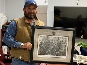 Carter Link's efforts with the Dryland EMS Association have not gone unnoticed by the Hanna RCMP who recently acknowledged his efforts by presenting him with a black and white print of the RCMP Musical Ride called Showtime as well as a Hanna Detachment challenge coin. Hanna RCMP photo