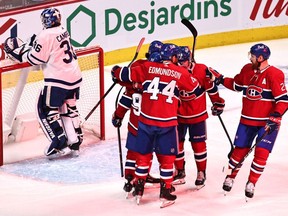 Montreal Canadiens left-wing Tomas Tatar celebrates his goal against Toronto Maple Leafs goaltender Jack Campbell with teammates during the first period at Bell Centre in Montreal on April 12, 2021.
