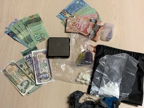 Drugs, cash and drug paraphernalia were seized by Kingston Police after executing a search warrant on Wednesday on Macdonnell Street in Kingston.