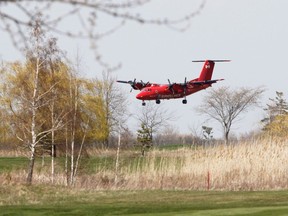 A Transport Canada surveillance plane lands at the Kingston Norman Rogers Airport on Saturday afternoon. The plane was seen in the skies over the city most of Saturday.