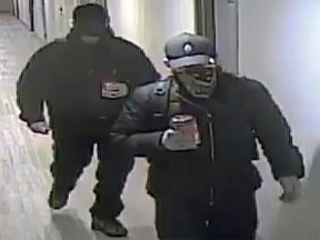 Kingston Police are searching for two men they said broke into two apartment buildings this month and stole property from residents.