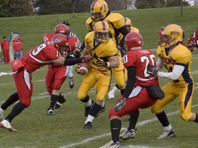 Rob Bagg of the Queen' Gaels tries to break through the York Lions line at Richardson Stadium in an undated file photo.
