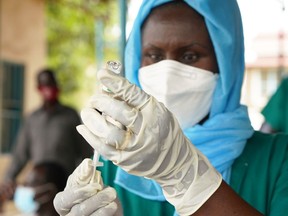 A health-care worker prepares to administer a vaccination for COVID-19 at the Police Hospital, on April 7, 2021, in Juba, South Sudan.