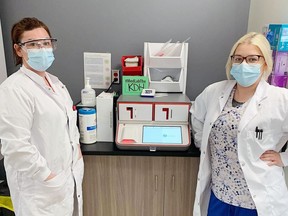 In honor of National Medical Laboratory Week officials from Blanche River Health are taking people behind the scenes of their laboratory services. In the photo are Carla McLaughlin, MLT, and Kayla Guse, MLT in front of the BioFire unit. This unit plays an integral role by detecting 22 different respiratory pathogens, including SARS-CoV-2, to help clinicians quickly rule in or rule out common causes of respiratory illness in about 45 mins.