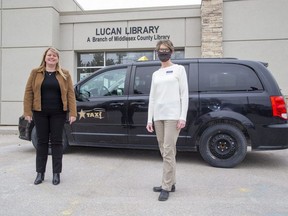 Lori Chouinard, president of Star Taxi, left, and Leigh Robinson, branch supervisor of the Lucan Public Library, helped launch a pilot project that offers free taxi rides to Middlesex County young people, as well as those in Exeter, so they can access mental health services in London. Derek Ruttan