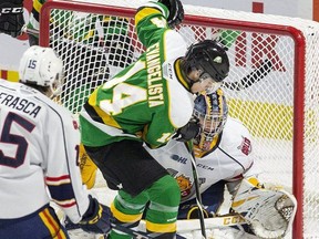 London Knights forward Luke Evangelista encroaches Barrie Colts goalie Arturs Silovs during a game Jan. 10, 2020, at Budweiser Gardens in London. (Derek Ruttan/The London Free Press)