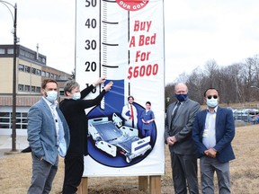 Photo by KEVIN McSHEFFREY/THE STANDARD
Jeremy Stevenson - St. Joseph’s General Hospital CEO, Leigh-Anne Doyle, William Elliott - St. Joseph’s Foundation of Elliot Lake chair; and Sanjeen Kumar hospital chief financial officer raising the thermometer for the beds’ replacement costs. They encourage residents to donate to the cause to replace the aging patient beds at St. Joseph’s General Hospital.