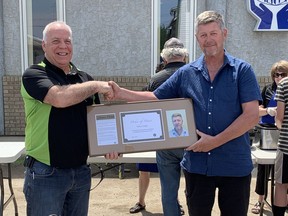 DNCU Board President Maurice Lalonde presents Francis Chabot with the Order of Merit Award in this file photo from 2019. Chabot served on the Zenon Park Credit Union Board of Directors for 15 years (7 of them as President). DNCU has now announced the closure of its Zenon Park branch.