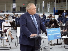 On April 1, the Ontario government implemented a four-week provincewide emergency brake shutdown, which came into effect at 12:01 a.m. Saturday. Ontario Premier Doug Ford is seen here listening to a question during the daily briefing at a mass vaccination centre in Toronto on Tuesday, March 30.