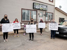 A peaceful protest against business closures during lockdowns was held in Petawawa April 13. Gathered outside Bombshells Tattoo Studio (from left) were tattoo artist Kari Gills, Susan Pearce, owner and protest organizer Elizabeth Davis, Tabitha Given and Crystal Shearstone.