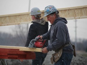 Wes DeBoer, of Wes DeBoer Construction, and his crew frame a new house on Kamal Drive in Sarnia. The median home price in the Sarnia area continued to rise in March, according to the Sarnia-Lambton Real Estate Board.