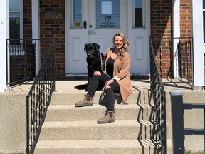 Sasha Ross poses with Trixie in front of Ryan's House in Sarnia. The Thedford woman is raising money with a run in September to help keep the recently opened addictions recovery facility operating. (Submitted)