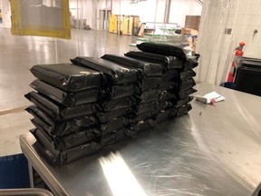 The Canada Border Services Agency provide his photo of
stacked vacuum-sealed packages of suspected cocaine allegedly seized March 31 at the Blue Water Bridge in Point Edward.