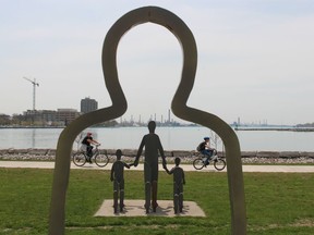 Cyclists pass the Victims of Chemical Valley memorial in Sarnia's Centennial Park. This year's Day of Mourning for those injured or killed on the job will be an virtual event on Wednesday because of the pandemic lockdown.