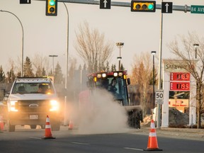 A city crew begins cleaning a winter’s worth of gravel and debris from the median on 100 Street just north of 84 Avenue. Spring cleaning of streets has begun and motorists are reminded to slow down and use caution when passing crews.
 PHOTO RANDY VANDERVEEN