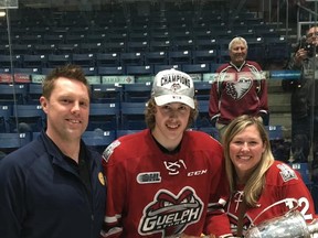 Photo provided

Sault native Keegan Stevenson (middle), poses with his parents, Jeremy and Selena, while holding the J. Ross Robertson Cup as a member of the 2018-2019 OHL champion Guelph Storm