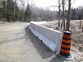 Concrete barriers have been placed on a section of Powerhouse Road in the Worthington area. Cody Proulx, 29, was killed Feb. 24 while working on Powerhouse Road, which leads to the Wabagishik Dam at Lorne Falls. John Lappa/Sudbury Star/Postmedia Network