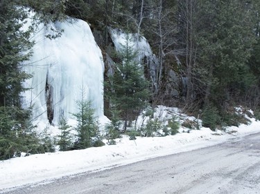 Lynn Bulloch checks out an ice wall along Portelance Road, north of Capreol. The snow and ice are melting in the woods along the logging road. Soon, the Wanapitei River will be fully open. Mary Katherine Keown/The Sudbury Star