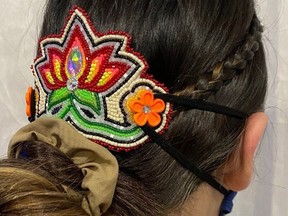 Ojibwe-Kwe artist Tara Kiwenzie's 'Ear Saver' beaded barrettes are a unique and attractive method of holding your face mask in place. ara Kiwenzie image