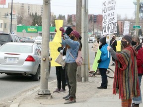 Advocates for a group of tenants facing eviction rally in front of 495 Notre Dame Avenue in Sudbury, Ontario on Saturday, April 3, 2021. Ben Leeson/The Sudbury Star/Postmedia Network