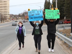 Students, faculty and community members express their opposition to a restructuring plan at Laurentian University during a demonstration on April 6.