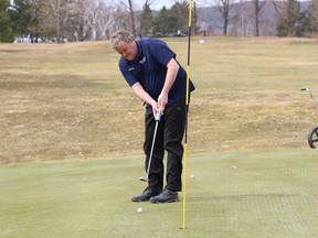 Todd Payzant putts on the 11th green at the Cedar Green Golf Club in Garson, Ont. on Wednesday April 7, 2021. John Lappa/Sudbury Star/Postmedia Network