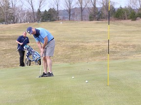 Rob Coe putts on the 11th green at the Cedar Green Golf Club in Garson, Ont. on Wednesday April 7, 2021. Golf courses will be allowed to open on Saturday, John Lappa/Sudbury Star/Postmedia Network