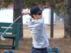 Zachari Mainville works on his swing at the Timberwolf driving range in Garson, Ont. on Wednesday April 7, 2021. John Lappa/Sudbury Star/Postmedia Network