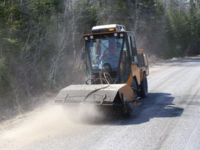 A City of Greater Sudbury sweeper clears sand and gravel off a road in Lively, Ont. on Thursday April 8, 2021. John Lappa/Sudbury Star/Postmedia Network