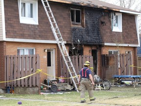 Fire crews respond to a blaze at a Ryan Heights housing complex on April 11. Three people perished as a result of the blaze.