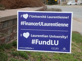 Signs have been popping up in Sudbury, Ont., showing support for students, staff and faculty at Laurentian University. John Lappa/Sudbury Star/Postmedia Network