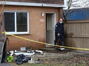 A forensic officer with the Greater Sudbury Police exits one of the damaged units at a housing complex fire in the Ryan Heights area in Sudbury, Ont. on Tuesday April 13, 2021. Police and the Ontario Fire Marshal's Office are investigating the fire. Three people died as a result of the April 11 fire John Lappa/Sudbury Star/Postmedia Network