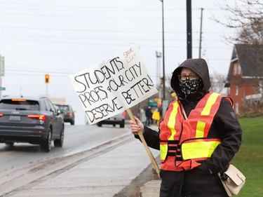 A protester takes part in a rally to fight Laurentian University program closures in Sudbury, Ont. on Friday April 16, 2021. John Lappa/Sudbury Star/Postmedia Network