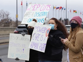 Protesters take part in a rally to fight Laurentian University program closures in Sudbury on April 16.