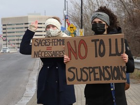 Protesters take part in a rally to fight Laurentian University program closures in Sudbury on April 16.