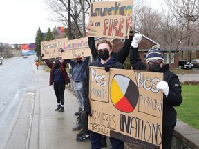 Protesters take part in a rally to fight Laurentian University program closures on April 16.