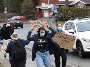 Protesters take part in a rally to fight Laurentian University program closures on April 16. More protests are planned for Friday.