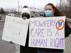 Protesters take part in a rally to fight Laurentian University program closures on Friday.