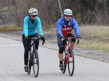 Judy Gougeon and Rob Poulin cycle at Delki Dozzi track on Monday.