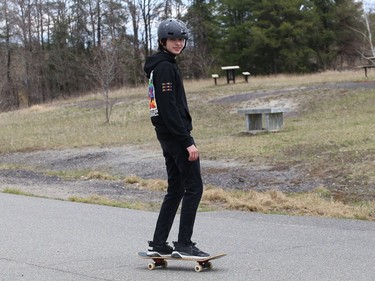 Evan Provost works on his skateboarding skills at Delki Dozzi track on Monday.