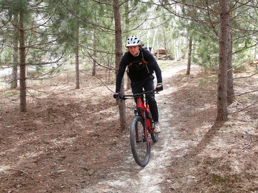 Alex Runciman rides a bike trail at Kivi Park on Thursday.