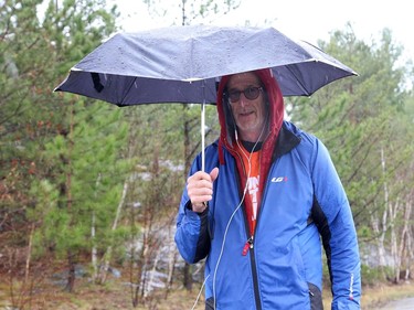 Rain or shine, Jean-Guy of Sudbury, Ont., has been going for a walk everyday to get his exercise in, especially since he can't go to a gym during lockdown. John Lappa/Sudbury Star/Postmedia Network
