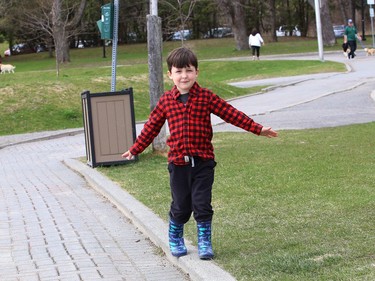 Benjamin Pigozzo, 4, balances on a curb near Bell Park in Sudbury, Ont. on Thursday April 29, 2021. John Lappa/Sudbury Star/Postmedia Network