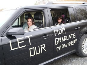 Midwifery student Chantal Longobardi and her daughters, Sophie and Annabelle, pictured, participated in a car rally to fight Laurentian University program closures in Sudbury on April 30.