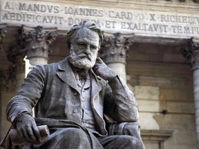 (FILES) This file photo taken on October 10, 2006 shows the statue of Victor Hugo near the chapel in the courtyard of the Sorbonne university in Paris.   He is worshipped as a saint in thousands of Vietnamese temples, held up as a prophet of European unity and a human rights hero for his campaigning against the death penalty.